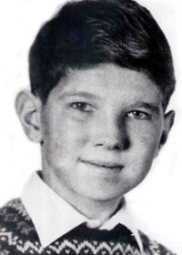 a young man in a black and white school photograph.